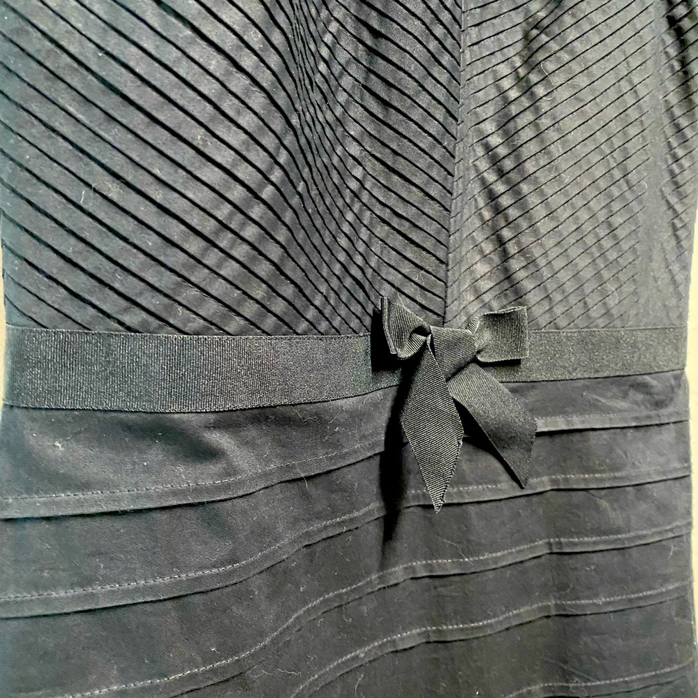 Black cotton strapless dress.